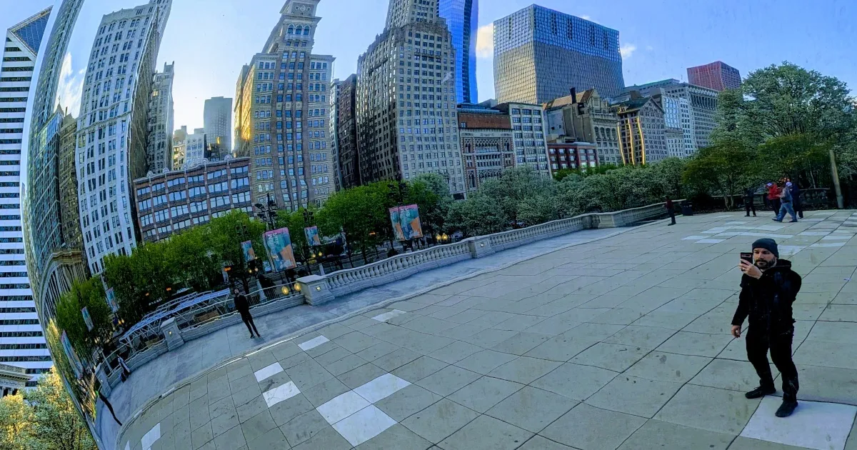 Ham and Chicago's skyline reflecting in Chicago's "The Bean" sculpture